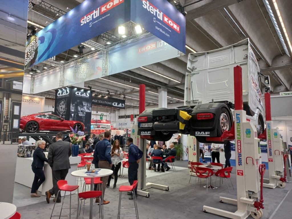 stand Stertil-Koni at Automechnanika 2022 with truck lifted with mobile columns